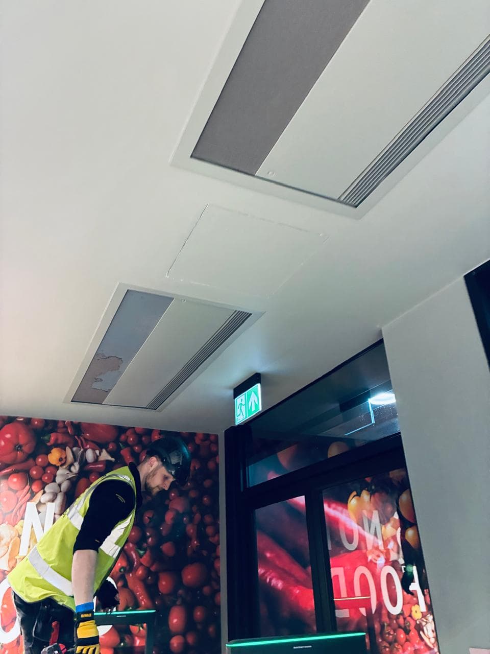 Ares technician carrying out an air conditioning ceiling installation